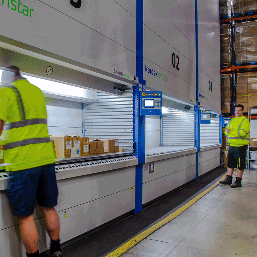 Two workers wearing High Vis in warehouse